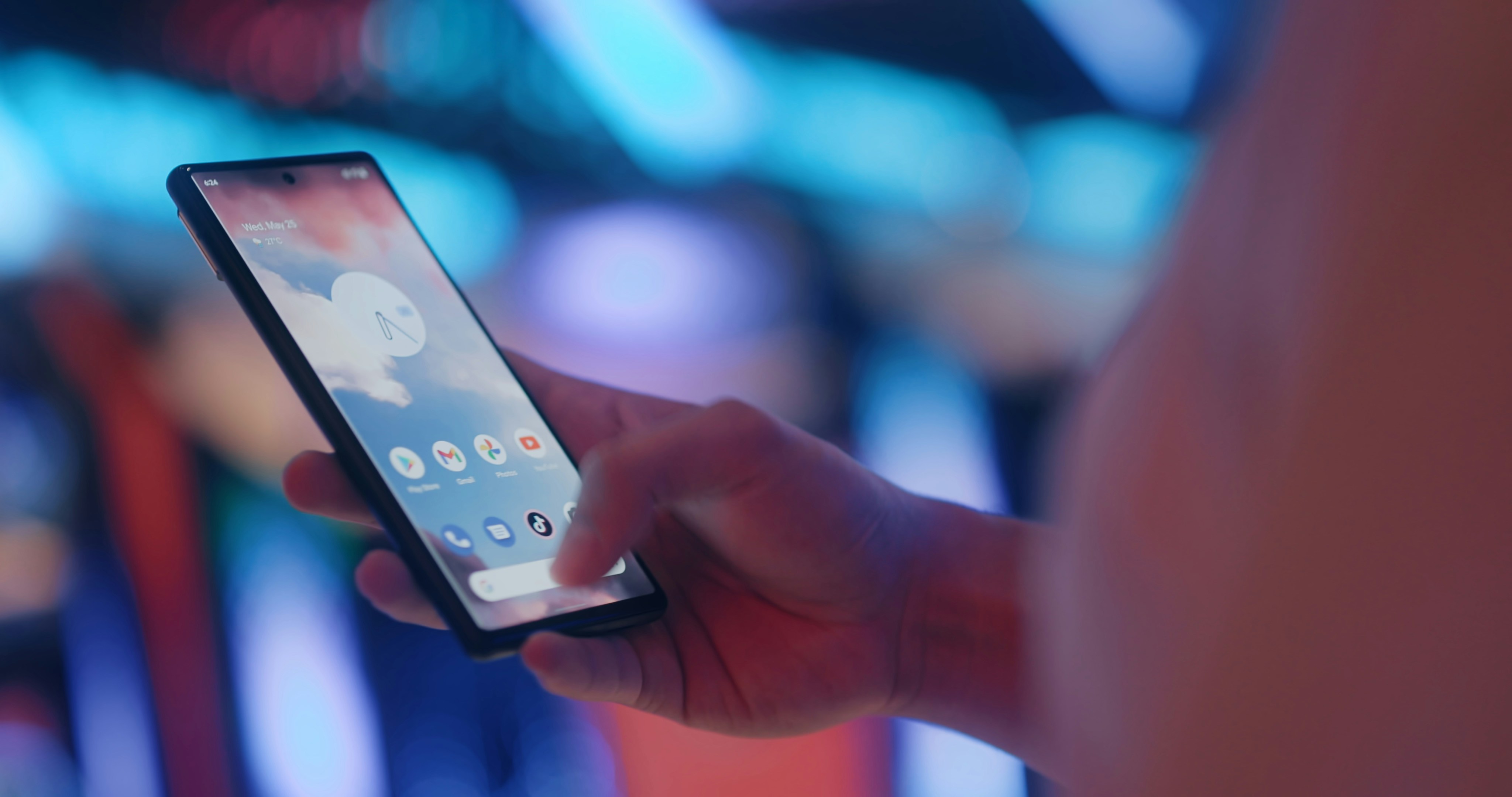 Creator livestreaming a game from a phone on the sideline